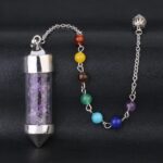 Purple crystal pendulum with 7 chakra beads on chain.