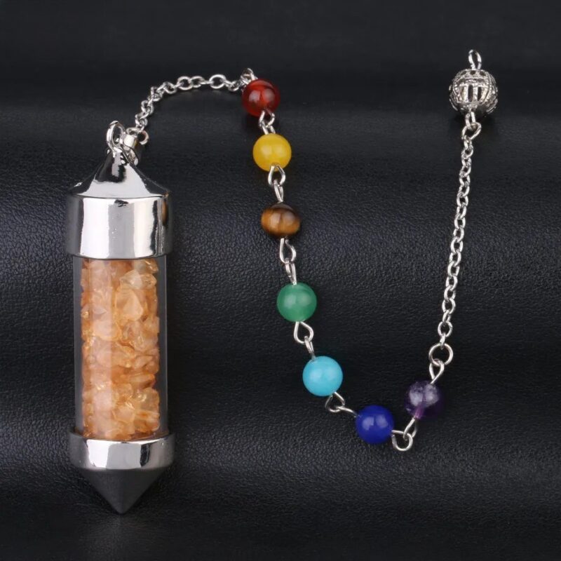 Crystal pendulum with chakra beads,  silver metal,  and orange crystals.