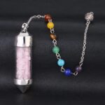 Crystal pendulum with rose quartz, seven chakra stones, and metal chain.