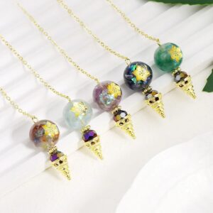 Four gemstone pendulums with gold-tone chains and star-shaped inlays.  Colorful polished gemstone balls.