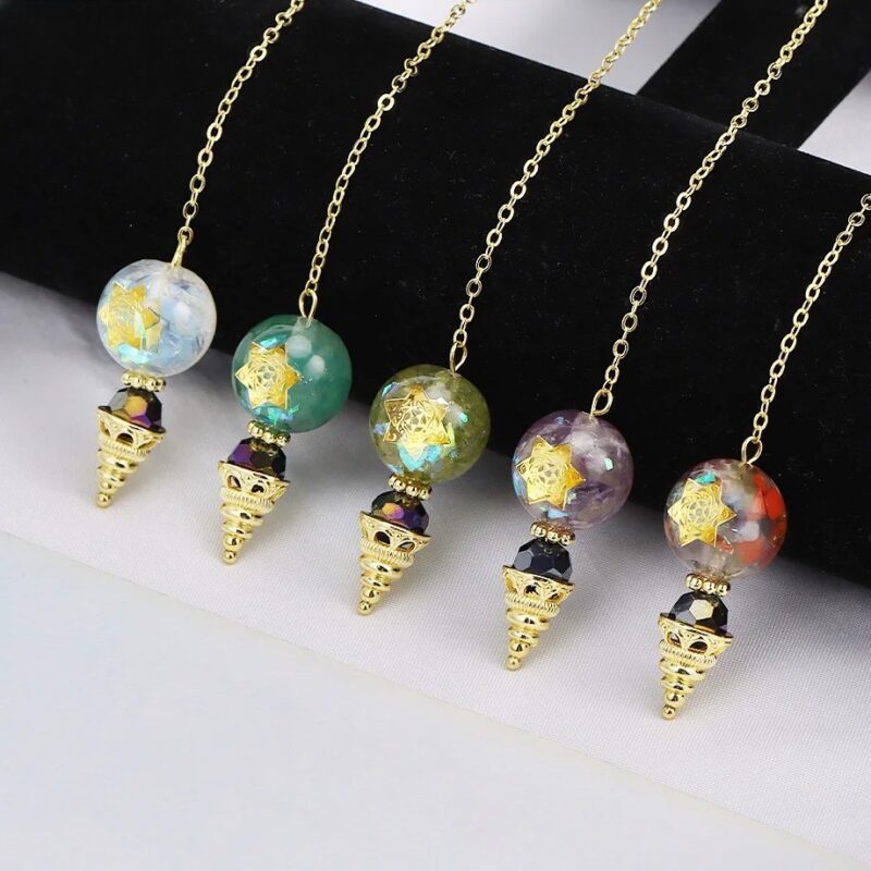 Gold-chained pendulums with colorful, star-embellished beads.
