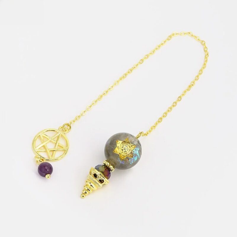 Gold-chained pendulum with gray stone orb, star design, and amethyst accents.  Spiritual, divination tool.