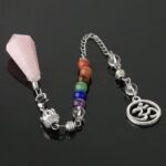 Pink rose quartz pendulum with chakra beads and om symbol.