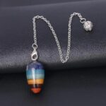 Multi-colored chakra pendulum with metal chain.