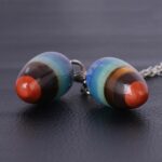 Multicolored eye-shaped pendant necklace charms.