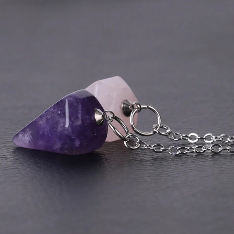 Two amethyst and rose quartz pendulum necklaces.