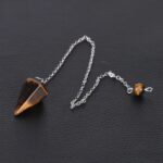 Tiger eye pendulum with metal chain.