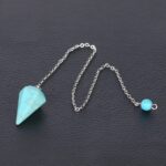 Turquoise pendulum with silver chain.