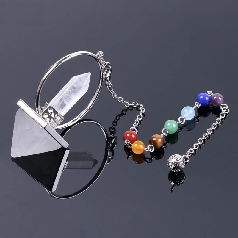 Crystal pendulum with pyramid base, quartz point, and chakra beads.