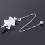 Clear quartz pendulum with silver chain and metal ball.  Crystal divination tool.