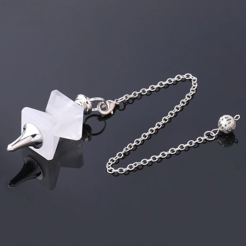 Clear quartz pendulum with silver chain and metal ball.  Crystal divination tool.