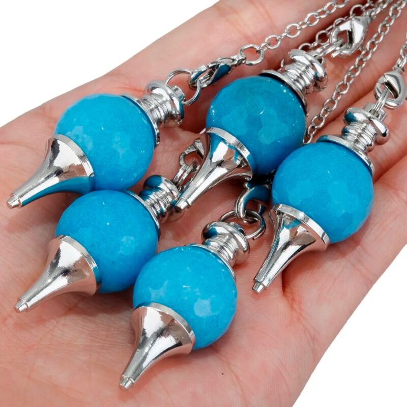 Four teal-blue gemstone pendulums with silver metal points.