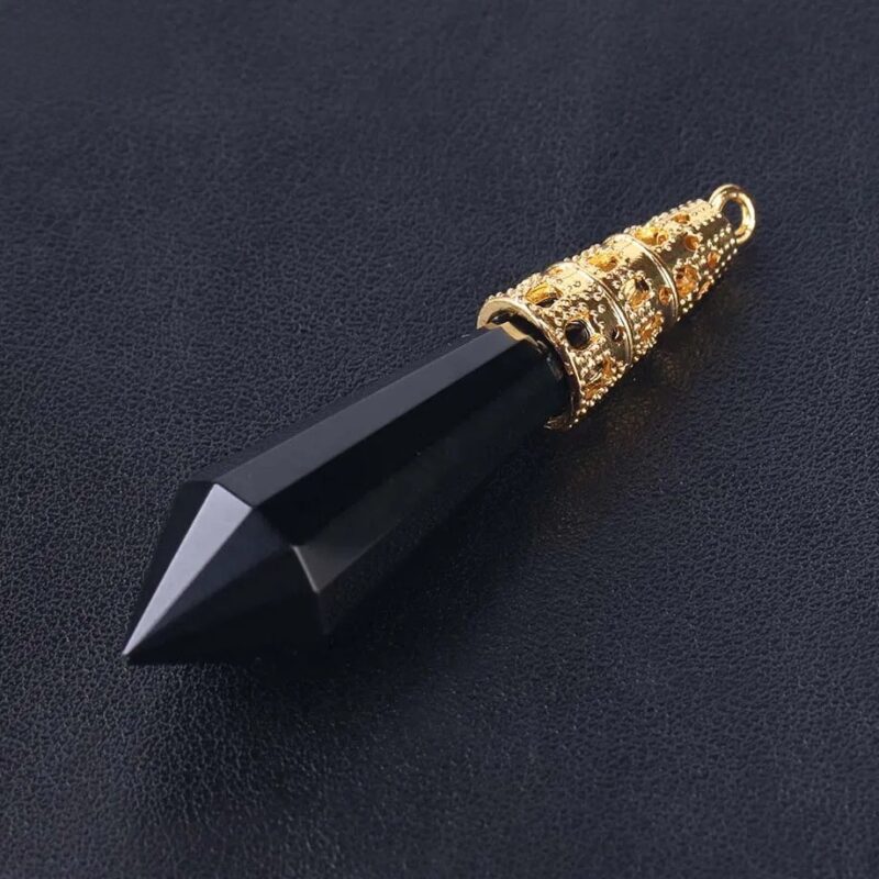 Black pointed crystal pendant with gold filigree.