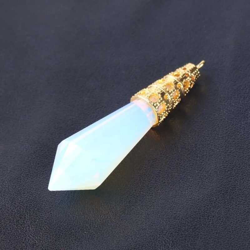 Light-blue opal teardrop pendant with gold filigree details.