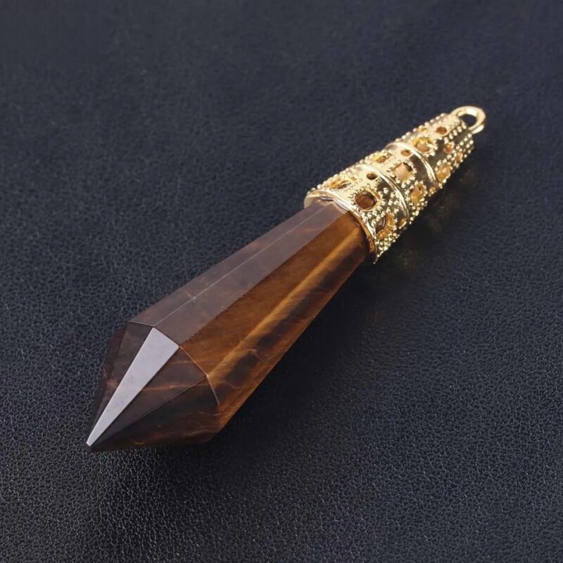 Tiger eye crystal pendant with gold accents.
