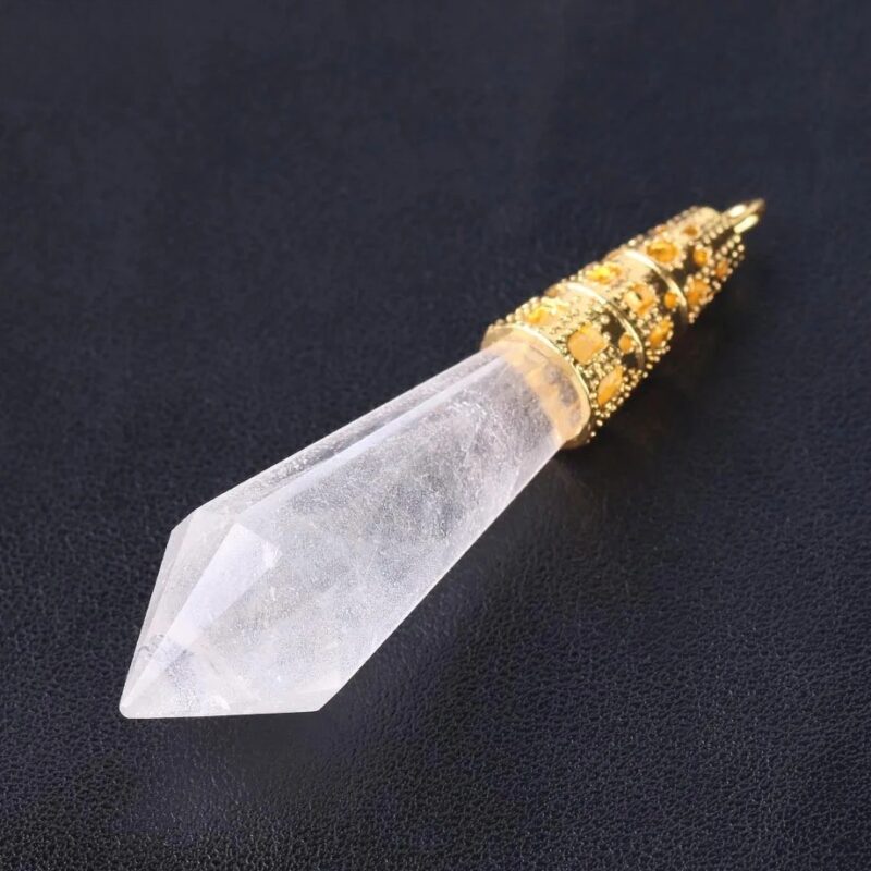 Clear quartz crystal pendant with gold-tone detailing.