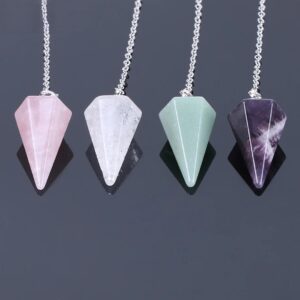 Four gemstone pendulums: rose quartz, clear quartz, green aventurine, amethyst.