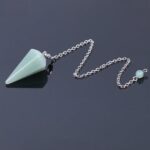 Green aventurine pendulum with silver chain.