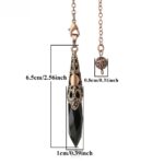 Black crystal pendulum with ornate copper-colored metal details.  Dimensions included.