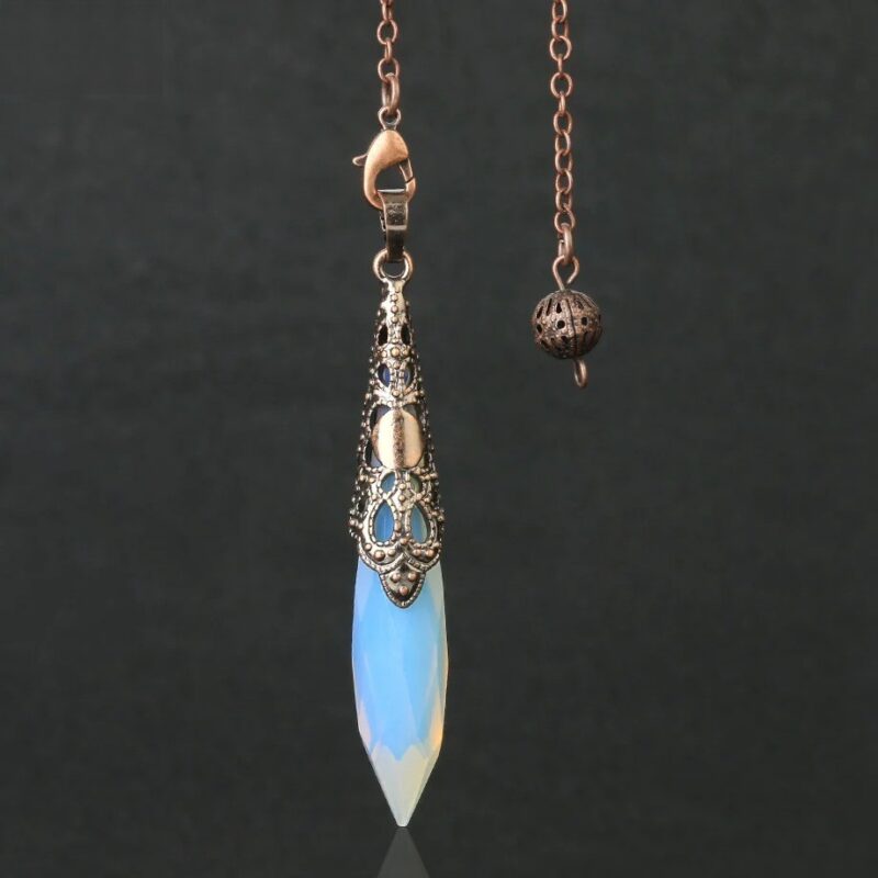 Light blue opal pendulum with ornate copper-colored metal accents.