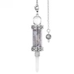 Silver-toned quartz crystal pendulum with small stones inside a glass tube.