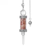 Silver-toned pendulum with a clear glass tube filled with small, reddish-orange stones,  topped with a clear crystal ball, and a small metal ball on the chain.