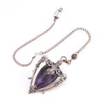 Purple amethyst pendulum, copper-toned metal frame, chain.