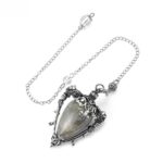 Grey stone pendulum, silver chain, ornate metal frame.