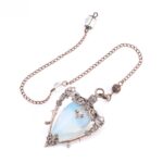 Copper-toned pendulum with pale blue-white opal teardrop-shaped stone and ornate metal accents.