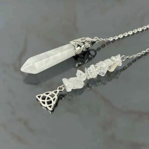 Clear quartz pendulum with metal accents. Crystal wand and tumbled stones. Spiritual/healing jewelry.