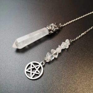 Clear quartz pendulum with metal accents and small crystals.