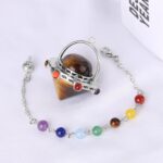 Tiger's eye pendulum with chakra beads.  Metal spinner, gemstone beads.  Spiritual jewelry.