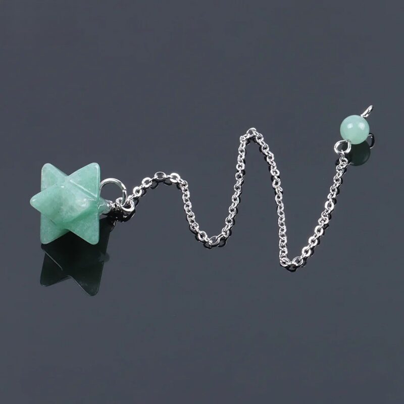 Green crystal star pendulum with silver chain.