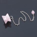 Rose quartz star pendulum with silver chain.
