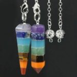 Colorful 7 chakra pendulum, silver chain, gemstone layers.