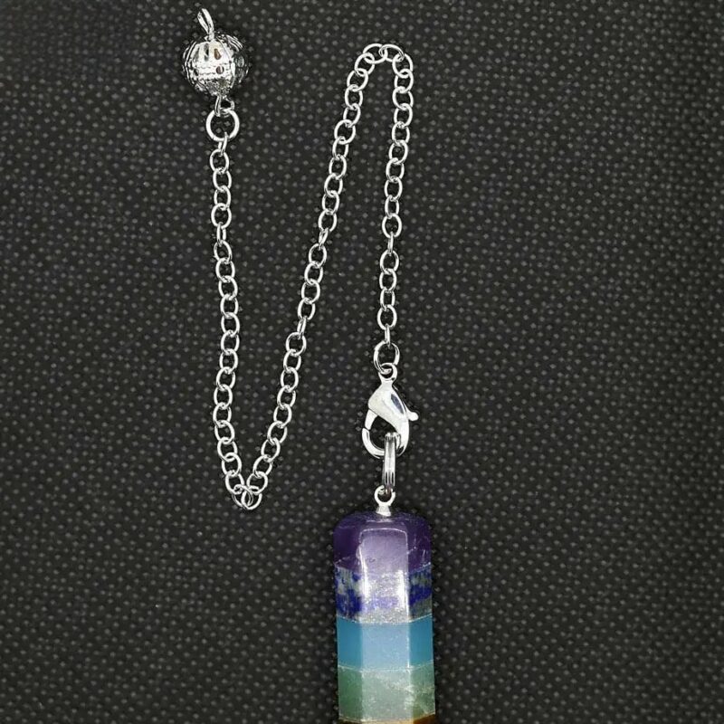 Seven chakra pendulum, metal chain, stone layers.