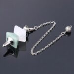 Crystal pendulum, light green and white stones, silver chain.