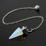 Opal pendulum, silver chain, spiritual accessory.