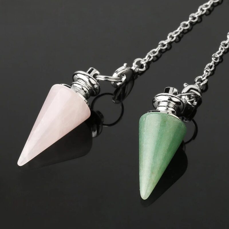 Two crystal pendulums, one rose quartz, one green aventurine, on chains.