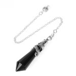 Black obsidian pendulum with silver dragon-shaped accents and chain.