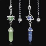 Three gemstone pendulums,  green and blue, with metal chains and star/triangle shapes.  Crystal healing jewelry.