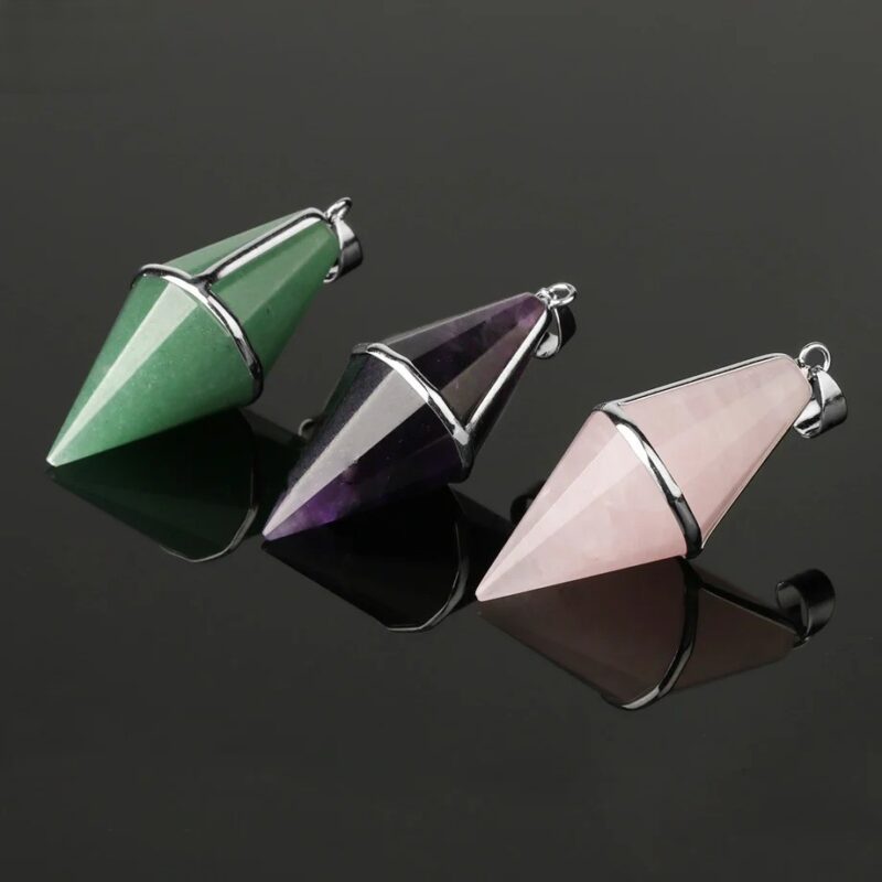 Three gemstone pendulums: green aventurine, amethyst, and rose quartz.