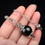 Black obsidian pendulum with silver chain.