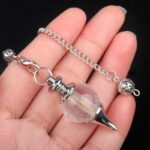 Clear quartz pendulum with silver chain and metal accents.