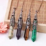 Four gemstone pendants,  bronze ornate settings,  amethyst, tiger's eye,  and malachite.