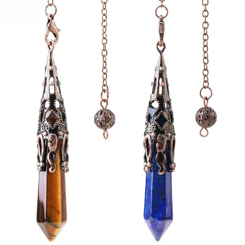 Two gemstone pendulums, one tiger's eye and one lapis lazuli, with ornate copper-toned metal settings.