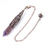 Purple amethyst pendulum with copper-toned metal accents and chain.