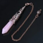 Rose quartz pendulum with ornate copper-toned metal cap.