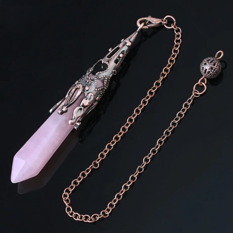 Rose quartz pendulum with ornate copper-toned metal cap.