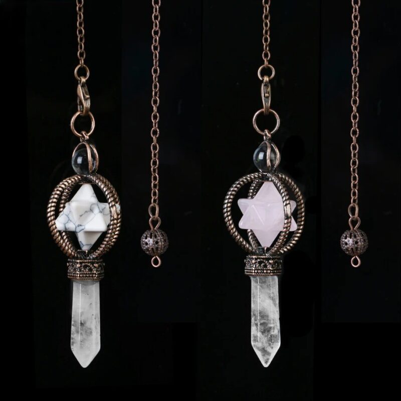 Three crystal pendulums, one with white, one with rose quartz, and one clear quartz, each with a metal star design.